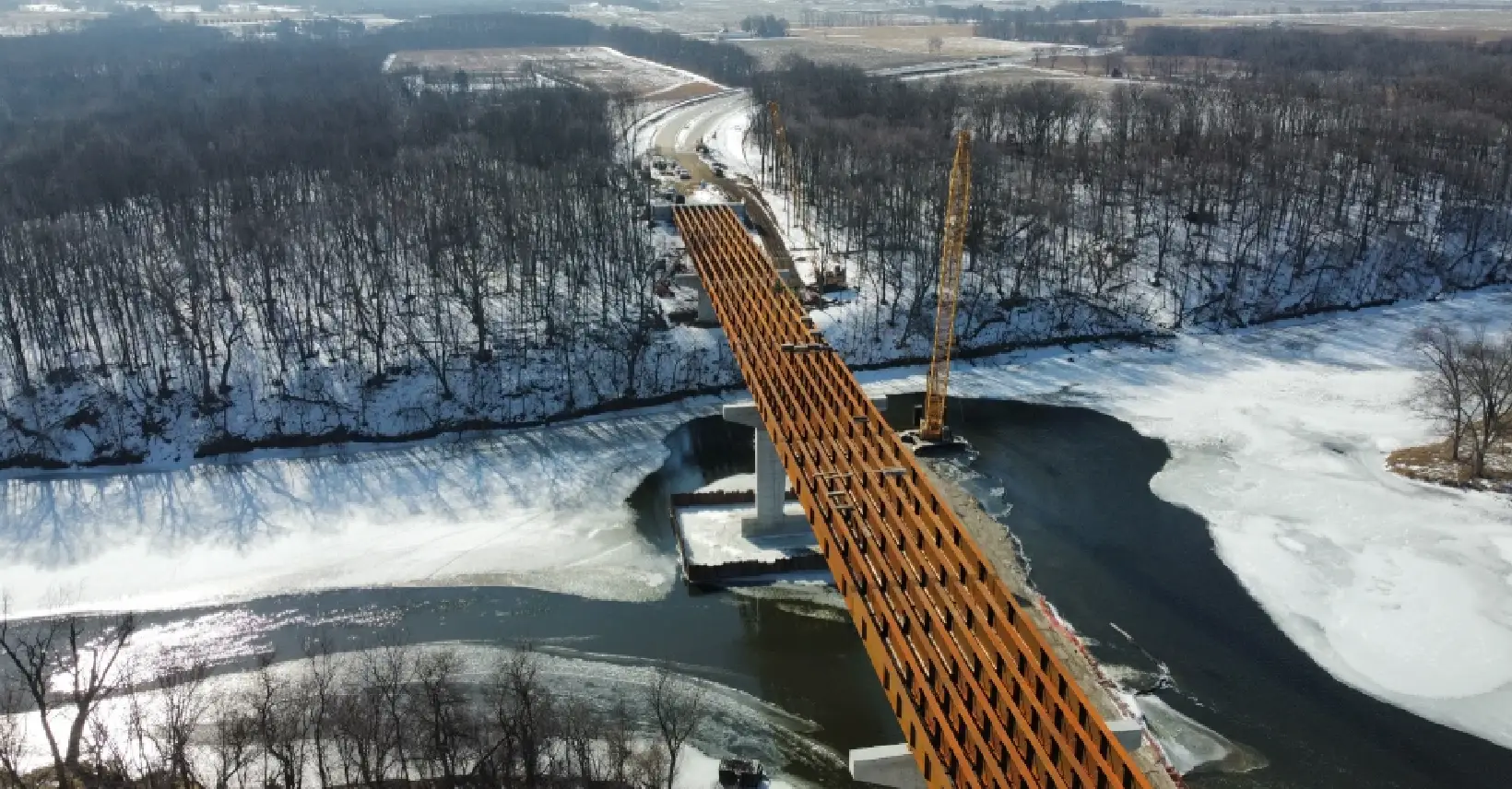 A bridge that is under construction in the snow.