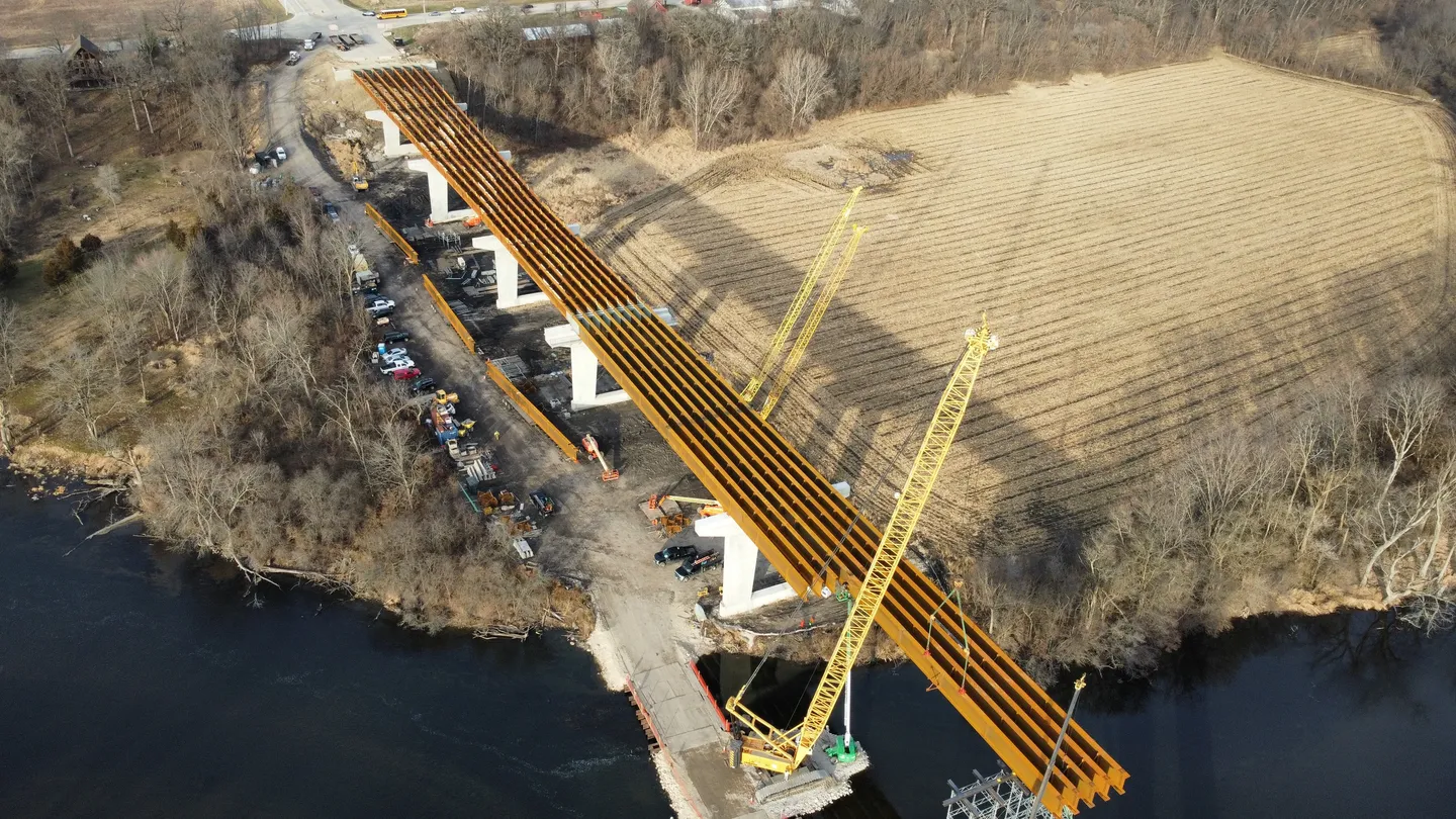 A bridge with a crane on it's side.